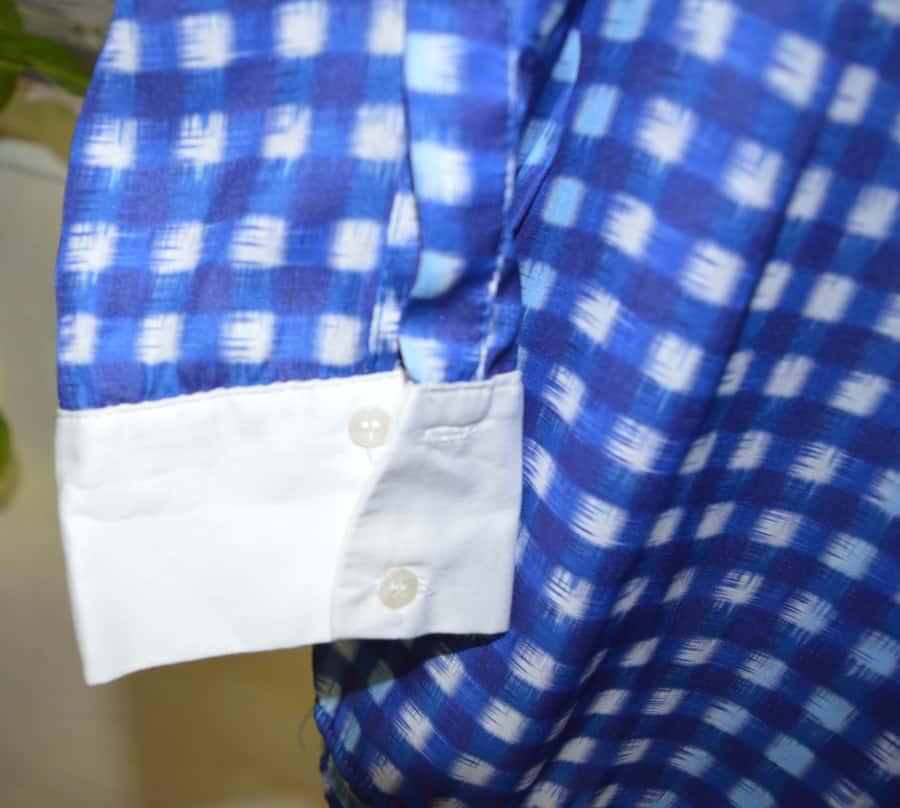 Détail poignet blanc chemiser carreaux